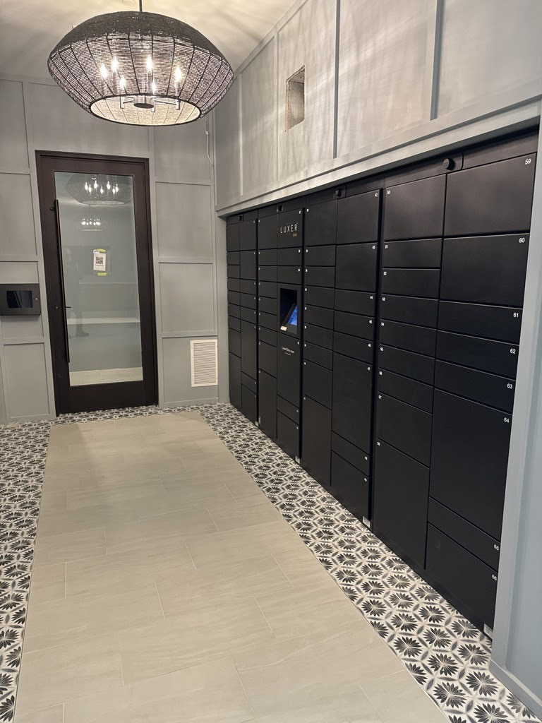 Luxer One® branded indoor package locker installation in a South Florida residential lobby