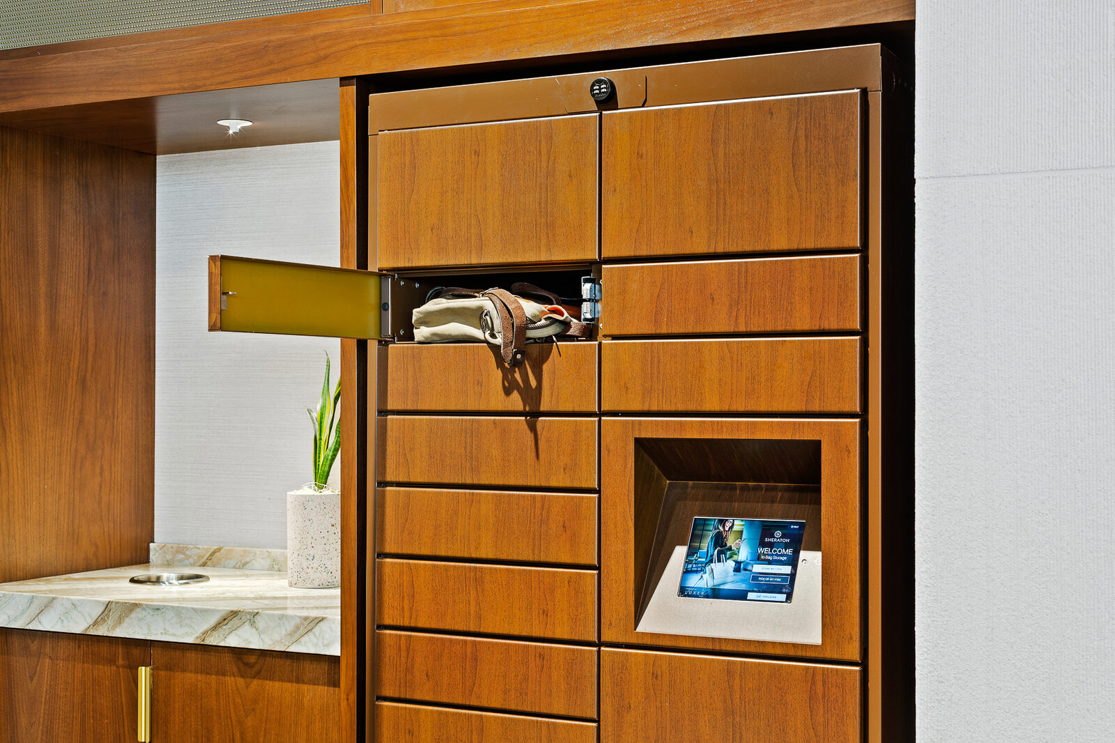 Luxer One indoor parcel lockers specified into a modern apartment lobby